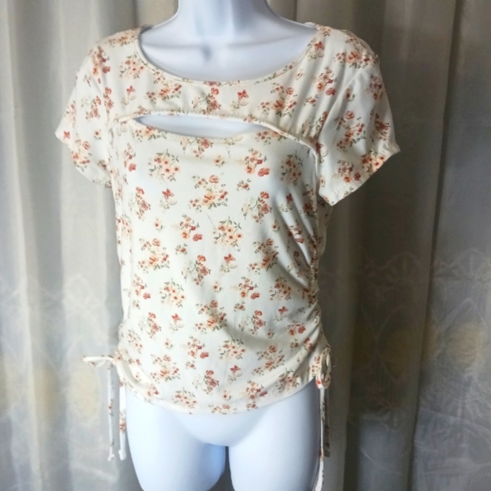 Beige floral top with cinching at sides